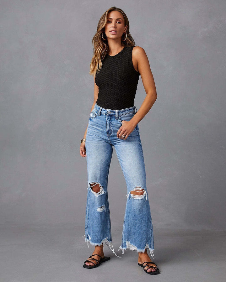 Women's high-waisted flared Destroyed Jeans with knee fraying and raw hem Mune Fashion