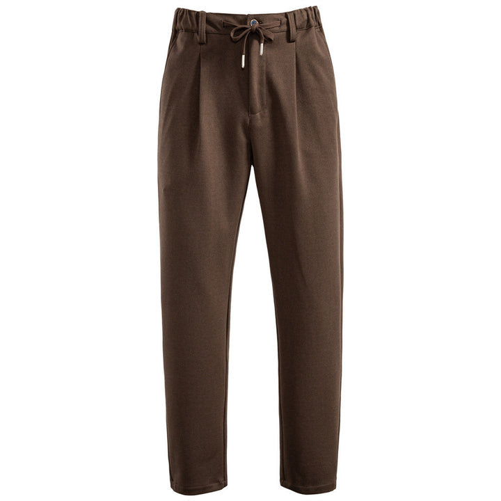 Men's pleated jogger-style trousers with drawstring, belt loops, and tapered cut Mune Fashion