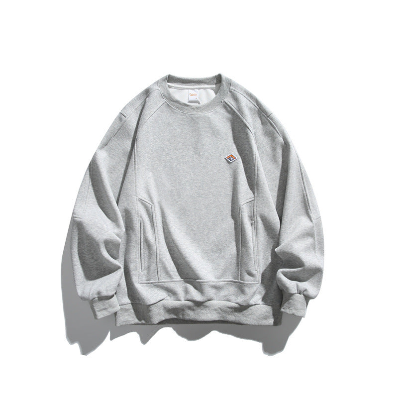 Unisex Oversize sweatshirt made of French terry with raglan sleeves, concealed side pockets, and a small logo patch Mune Fashion