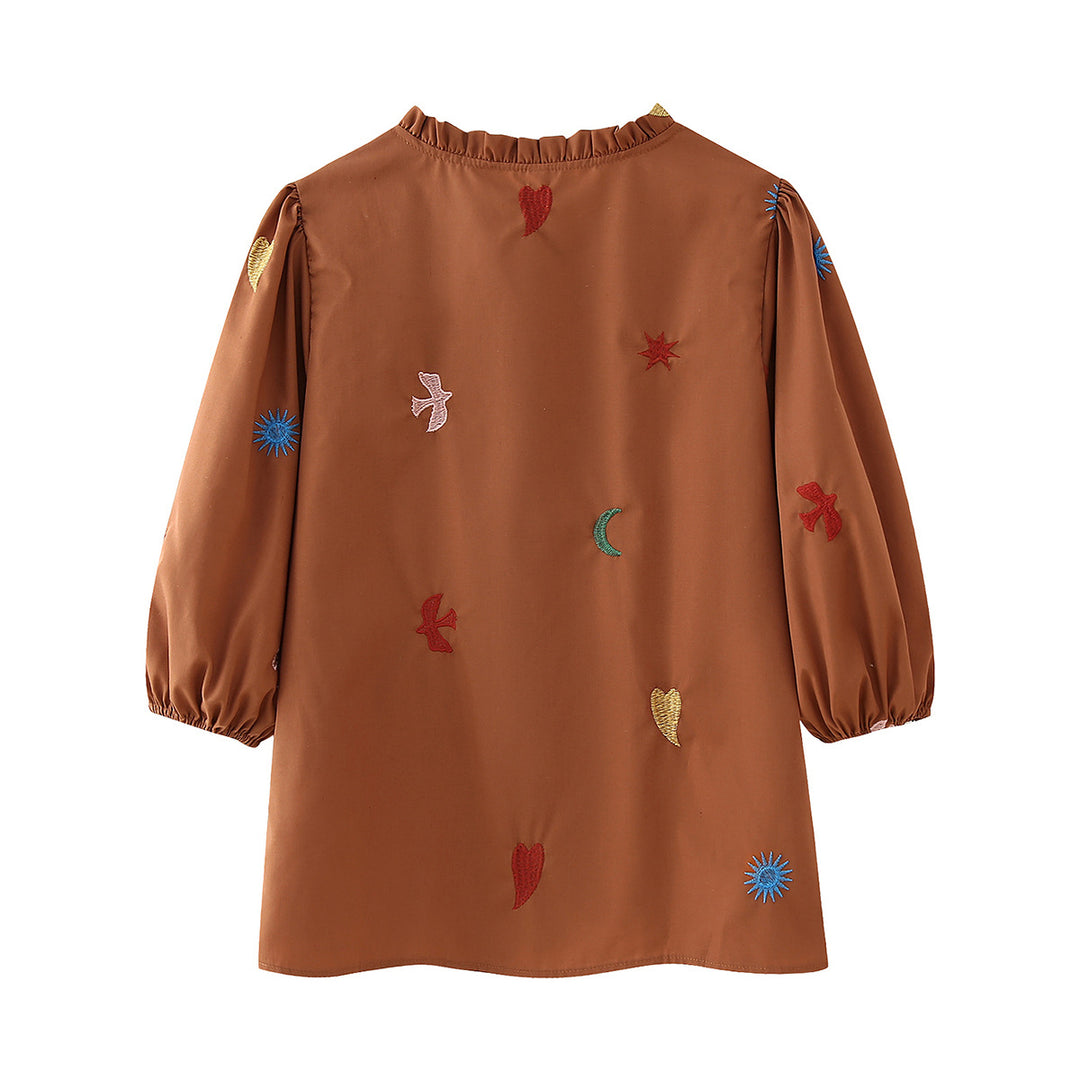 Ladies embroidered tunic blouse with ruffled collar, continuous button placket and balloon sleeves Mune Fashion