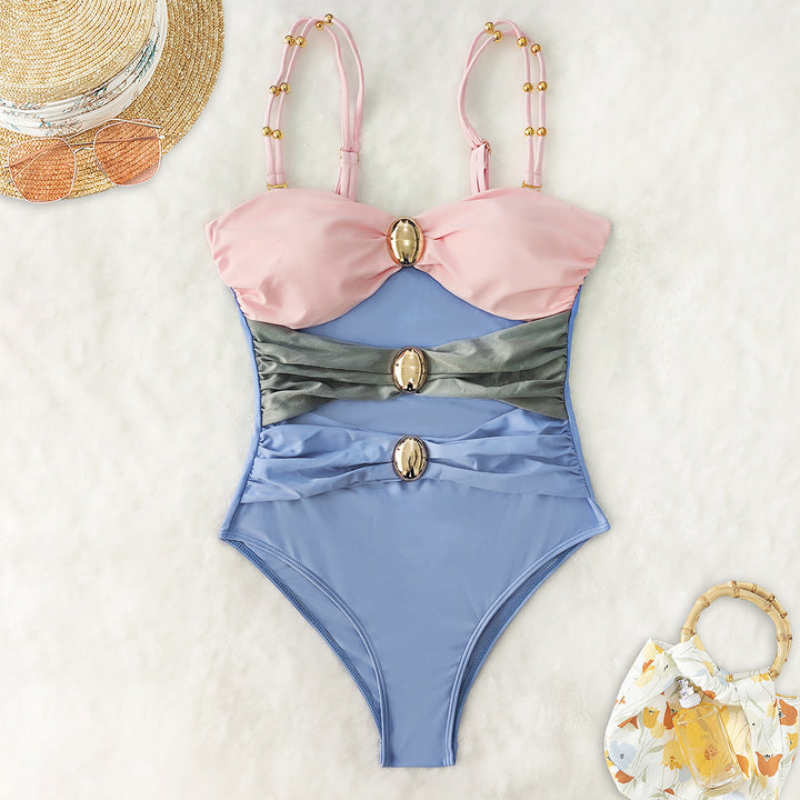 Women's one-piece swimsuit with intricate cut-outs and decorative metal accents Mune Fashion