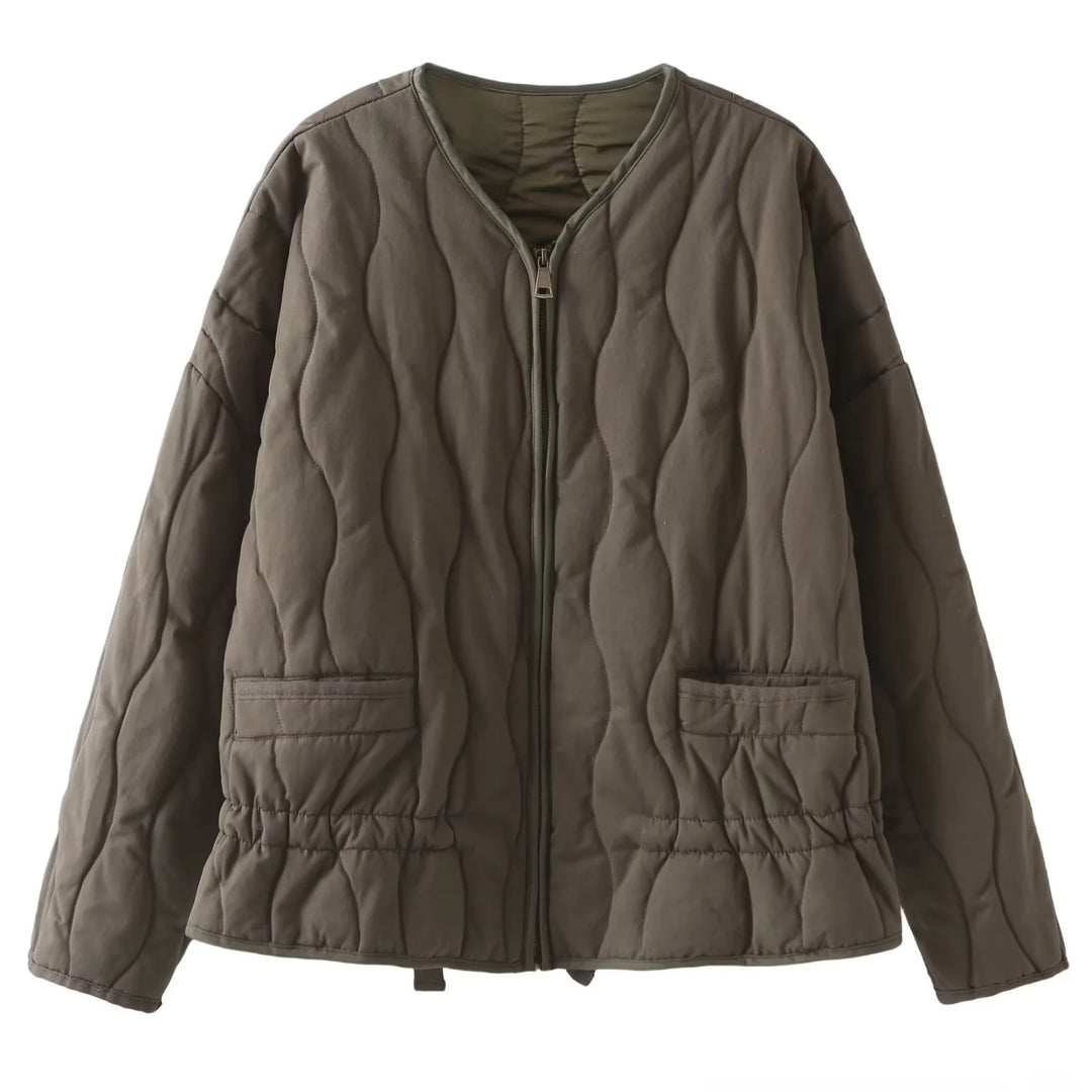 Ladies' nan quilted lightweight transitional jacket with wave quilting, patch flap pockets, and drawstring hem Mune Fashion