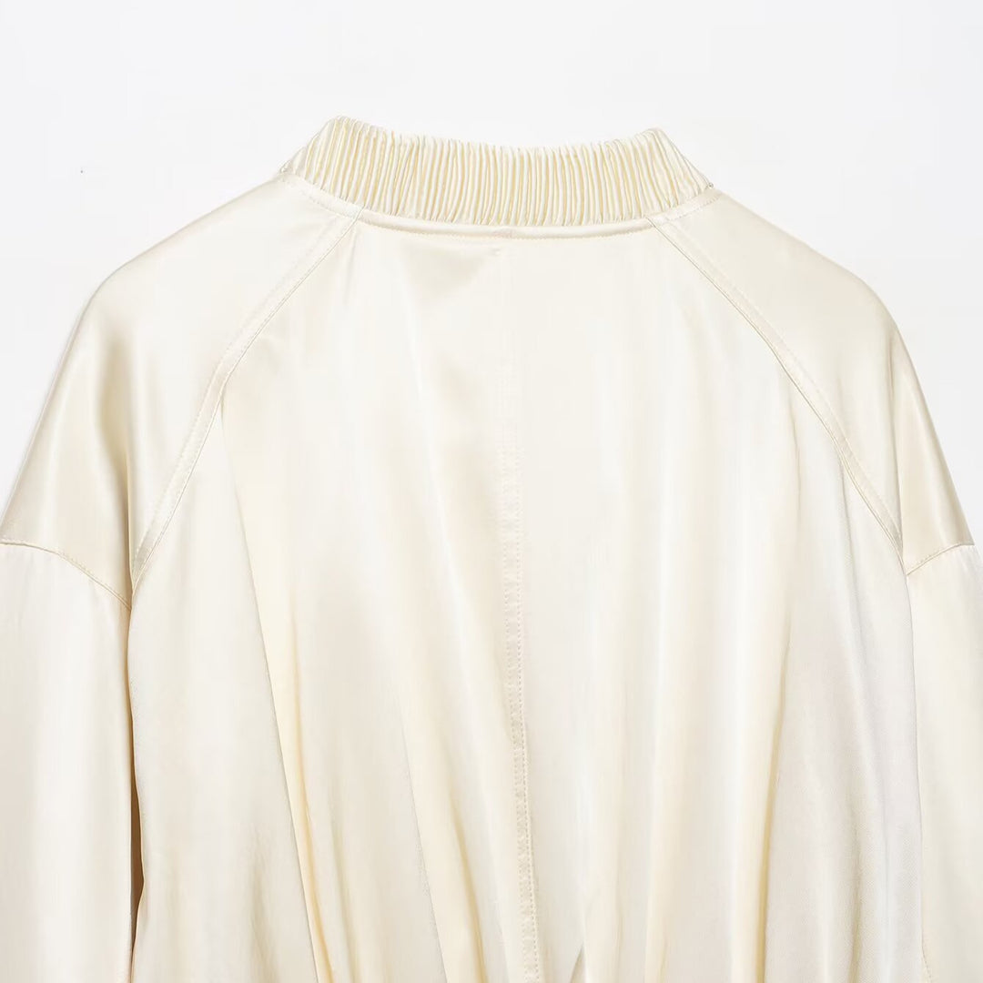 Women's cropped bomber jacket made of vegan leather look with voluminous raglan sleeves and ribbed cuffs.