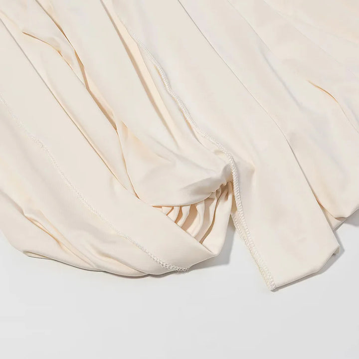 Women nan pleated cape top with wide fall, long sleeve slits, and elastic round neckline Mune Fashion