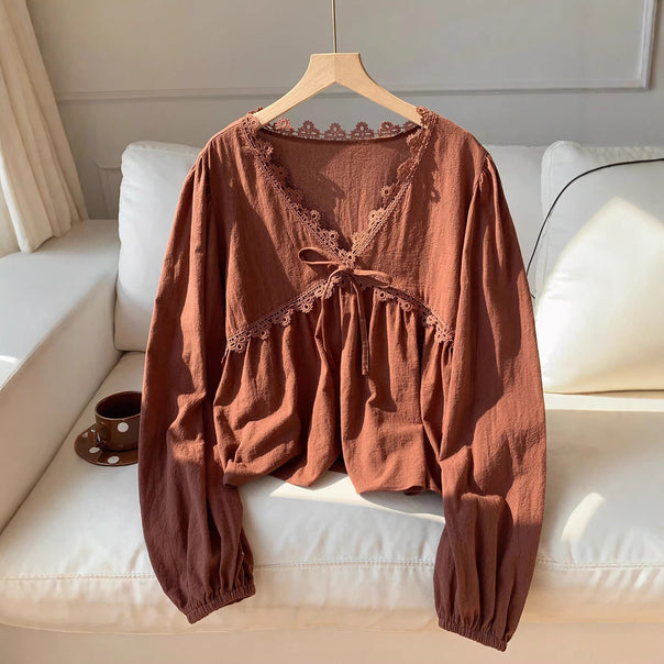 Women’s short blouse with empire cut, V-neck, lace trim, and tie bow Mune Fashion