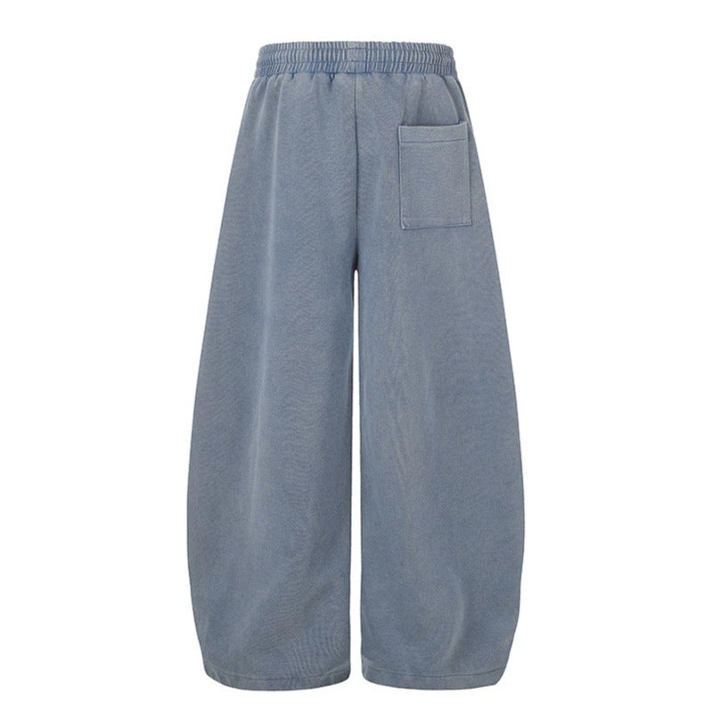 Women's extra-wide palazzo harem pants made of sweatshirt fabric with a high comfort waistband, drawstring, and large graphic print Mune Fashion
