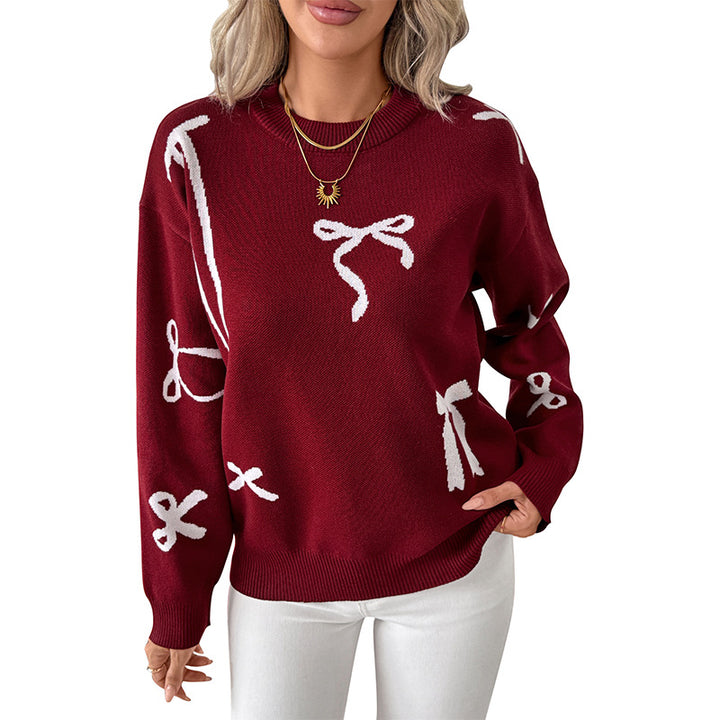 Ladies fine jacquard knit pullover with bow motif, round neckline and ribbed hem