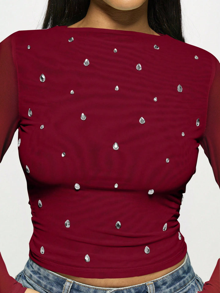 Women's fitted mesh top with rhinestone applications and boat neck Mune Fashion