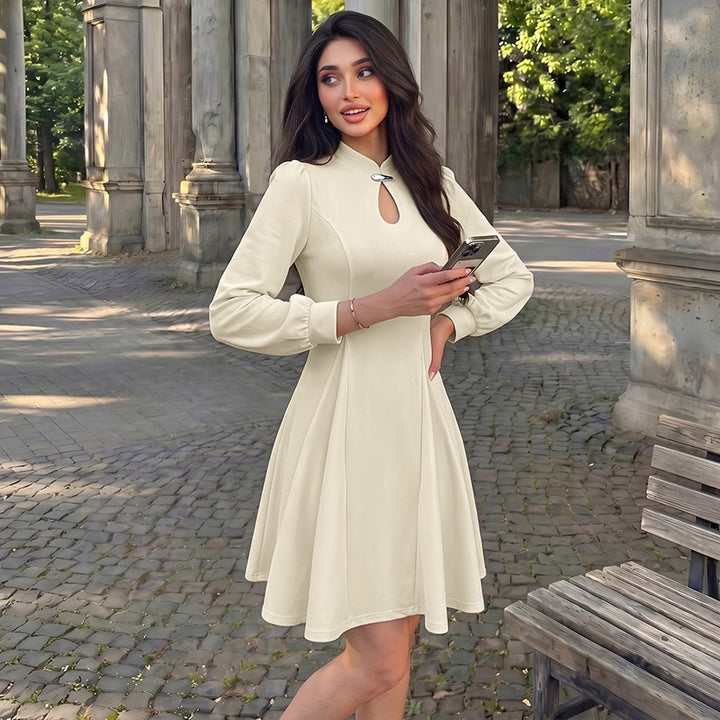 Women's elegant fitted skater dress with stand-up collar, keyhole detail & long balloon sleeves Mune Fashion