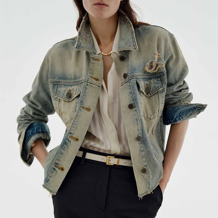 Women’s oversized destroyed denim jacket with raw hem, patch chest pockets, and vintage wash Mune Fashion