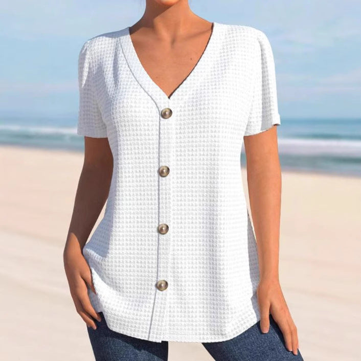 Women's finely structured V-neck top with decorative button placket and slightly flared silhouette Mune Fashion