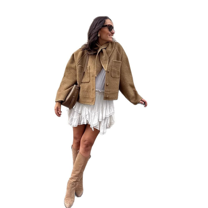 Women's short jacket made of wool blend with a suggested shawl collar, decorative seams, and boxy cropped cut Mune Fashion