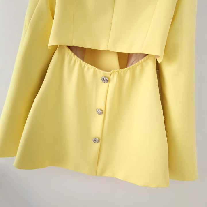 Women's tailored blazer with curved layered collar, figure-flattering darts, and decorative accent button Mune Fashion