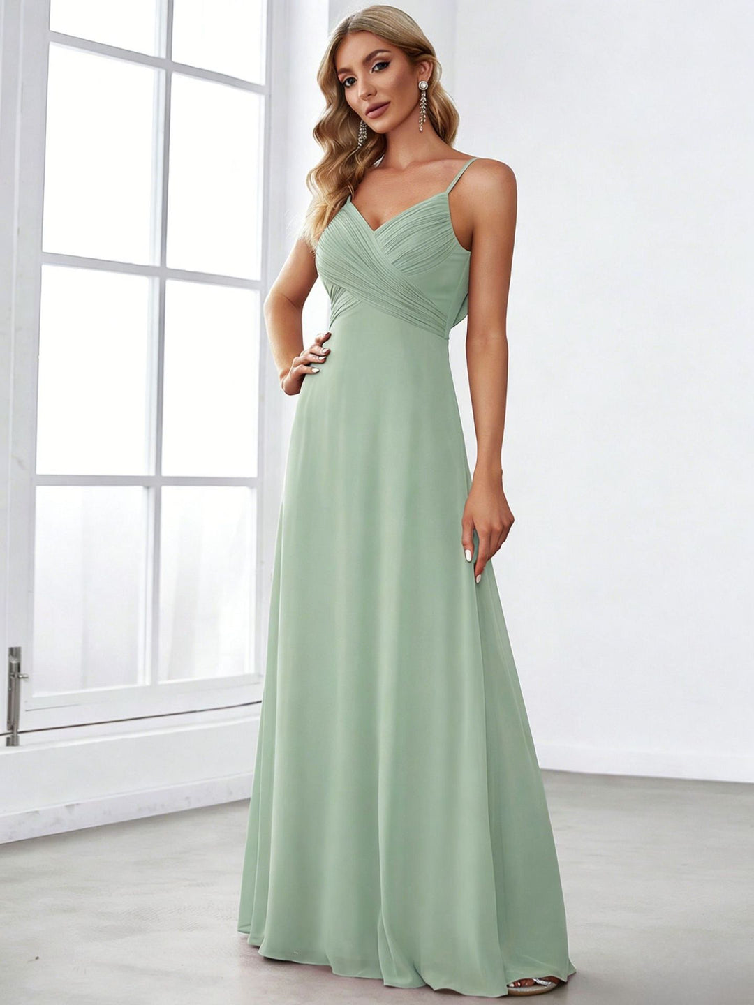 Ladies flowing chiffon evening dress with crossed draping, empire waist and fine spaghetti straps Mune Fashion