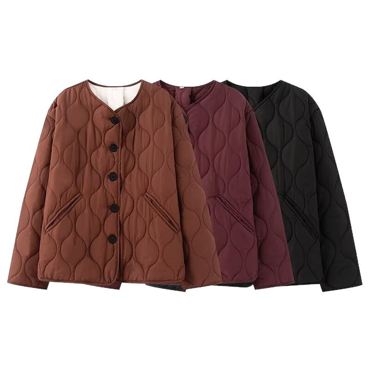 Women's quilted jacket without collar with round neckline, boxy cut and decorative wave quilting Mune Fashion