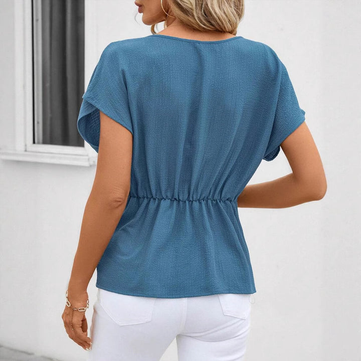 Women's fitted short sleeve draped shirt with side knot sling and textured crepe look Mune Fashion