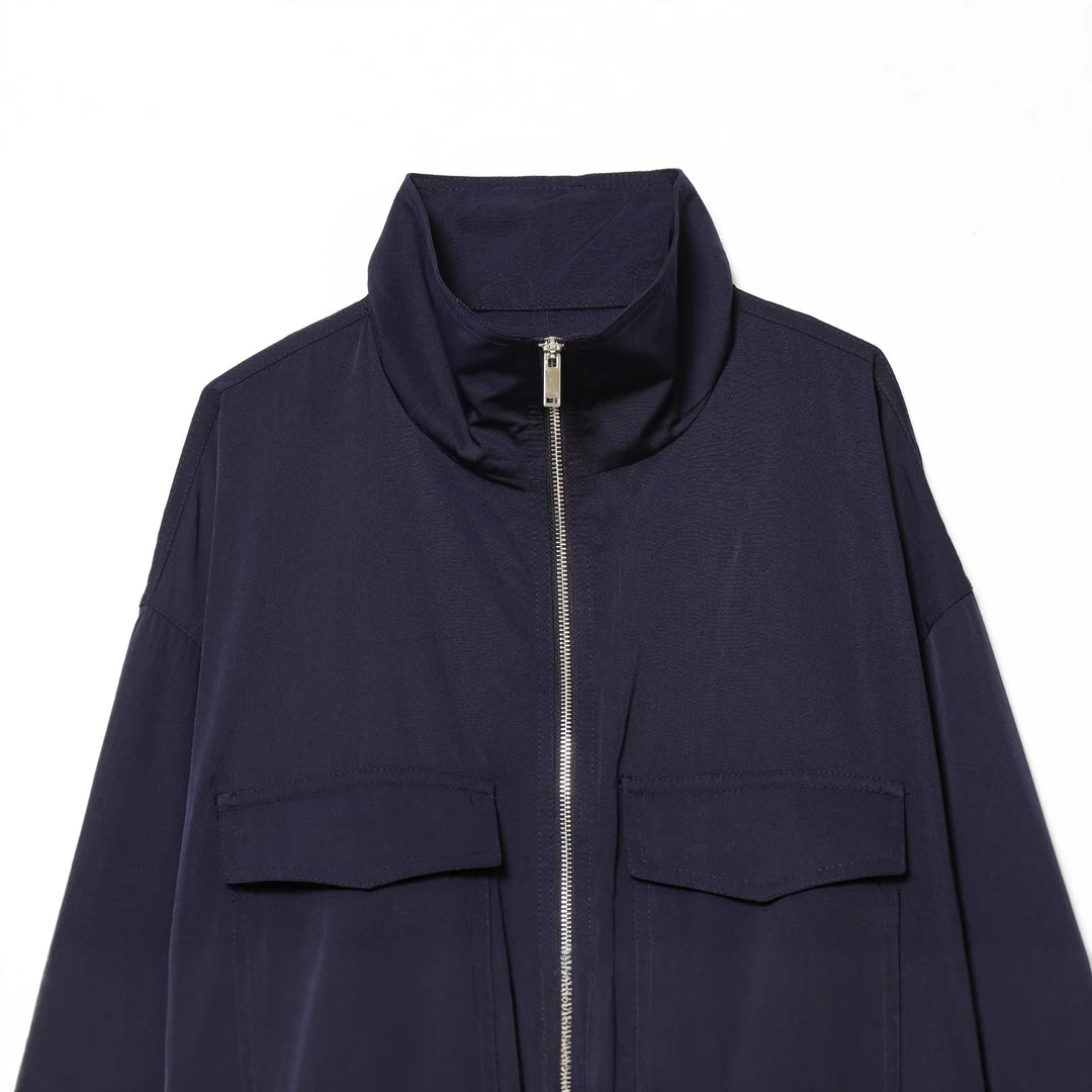 Women's short utility blouson jacket with standing collar, patch chest pockets, full zip, and elastic hem Mune Fashion