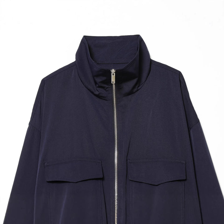 Women's short utility blouson jacket with standing collar, patch chest pockets, full zip, and elastic hem Mune Fashion