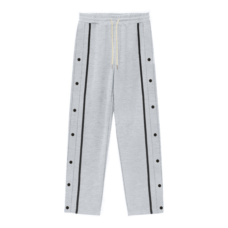Men's Nan sporty jogging pants with side snap button placket, elastic drawstring waistband, and striking side stripes Mune Fashion