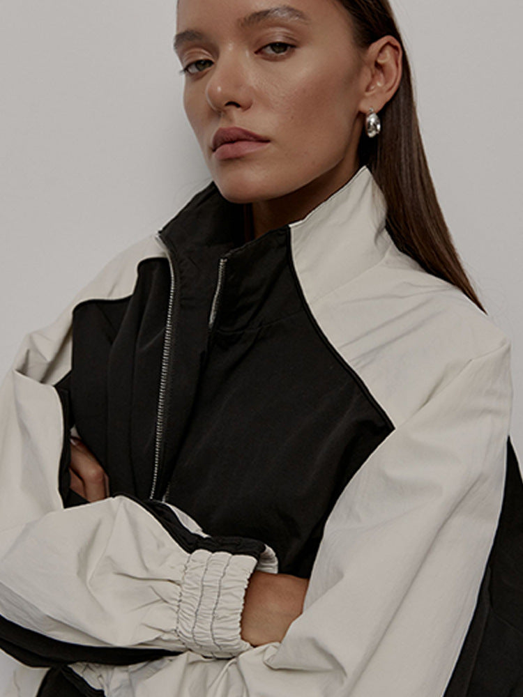 Women's oversized sporty track jacket with high stand-up collar and raglan sleeves Mune Fashion