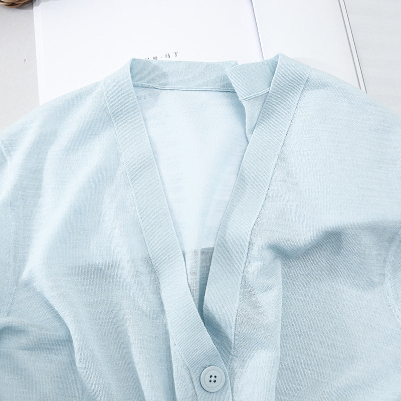 Women's Lightweight Oversized Cardigan made of fine knit with deep V-neck and decorative button placket Mune Fashion