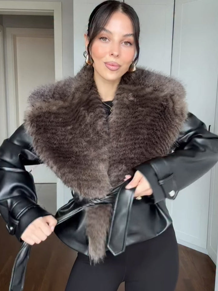 Women's short jacket in biker blouson style made of imitation leather with voluminous faux fur shawl collar and waist belt Mune Fashion