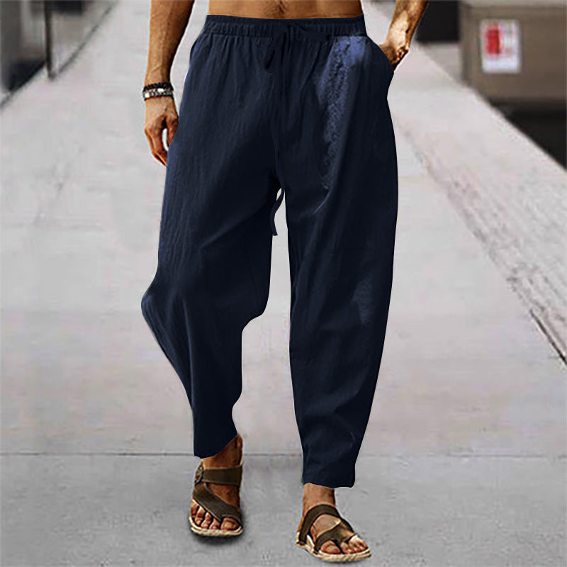 Men's loose linen casual pants with elastic tunnel drawstring waistband, low crotch, and tapered ankle length Mune Fashion