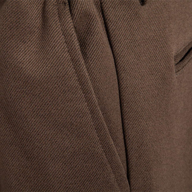 Men's pleated jogger-style trousers with drawstring, belt loops, and tapered cut Mune Fashion