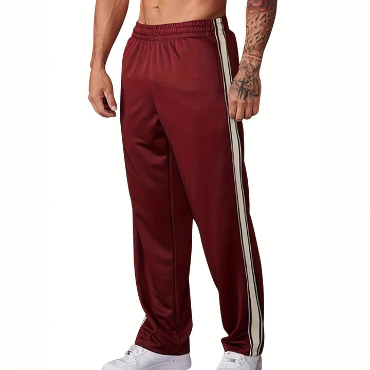 Men's sporty training pants with side tape stripes and elastic waistband Mune Fashion