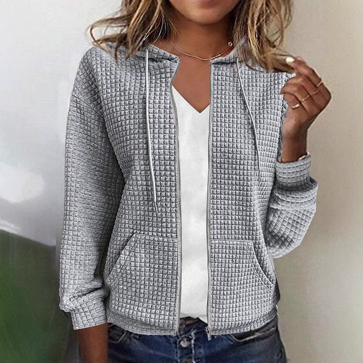 Women's quilted hooded jacket with waffle texture, full zip and kangaroo pockets Mune Fashion