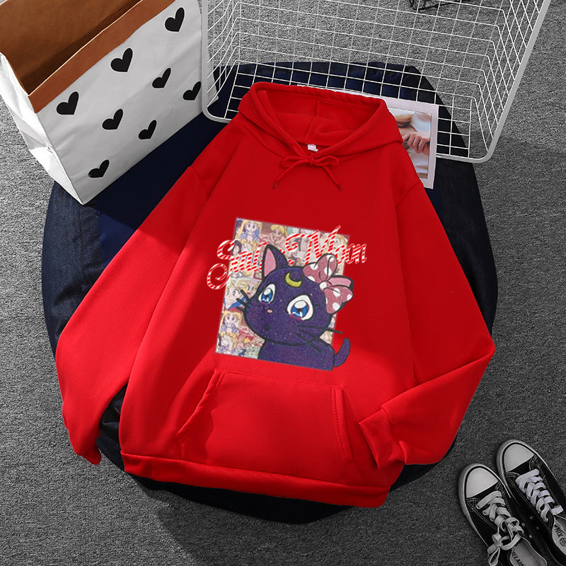 Women's oversized hoodie with shimmering anime cat motif, kangaroo pocket, and soft fleece lining Mune Fashion
