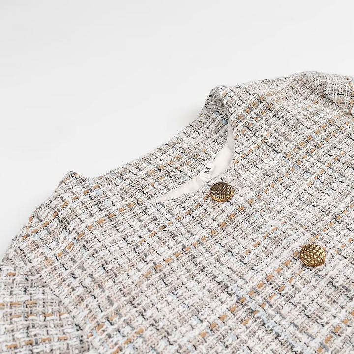 Ladies short jacket made of bouclé tweed with a round neckline and decorative gold buttons Mune Fashion