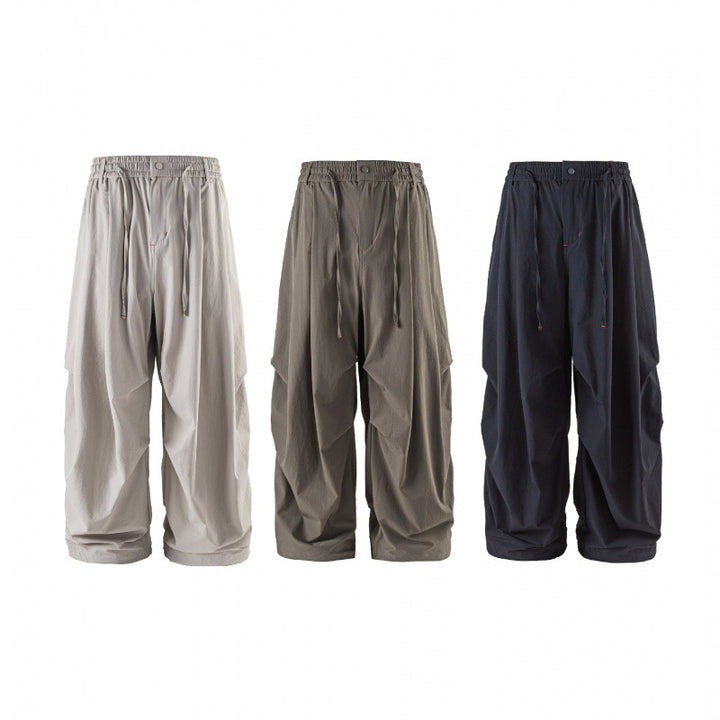 Unisex Loose-fitting technical cargo pants with elastic waistband, drawstring, and zip pockets Mune Fashion