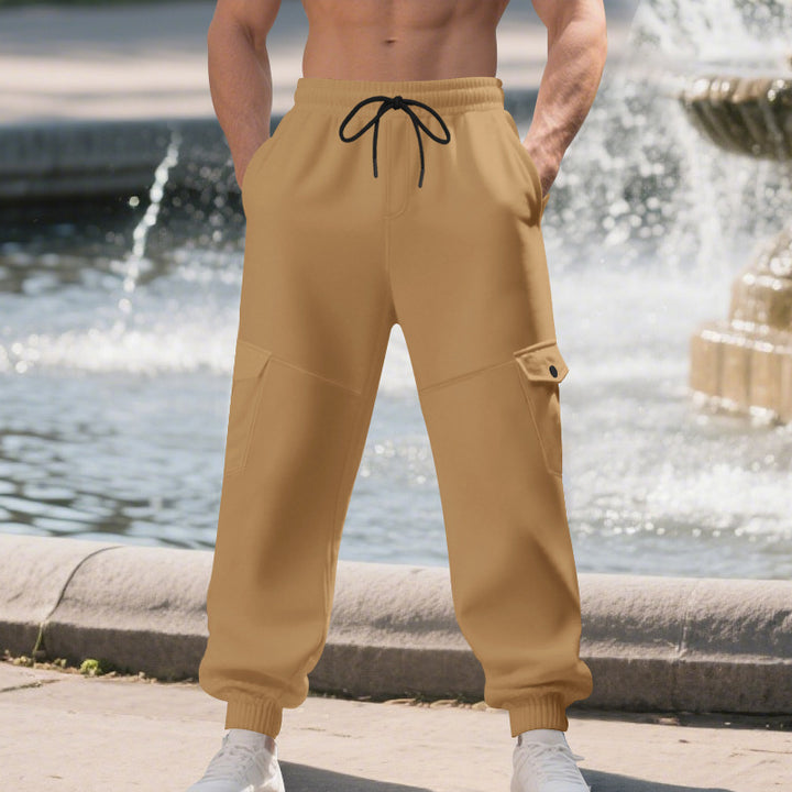 Men's urban-military cargo joggers with knee-quilted inserts, side flap pockets, and ribbed leg openings Mune Fashion
