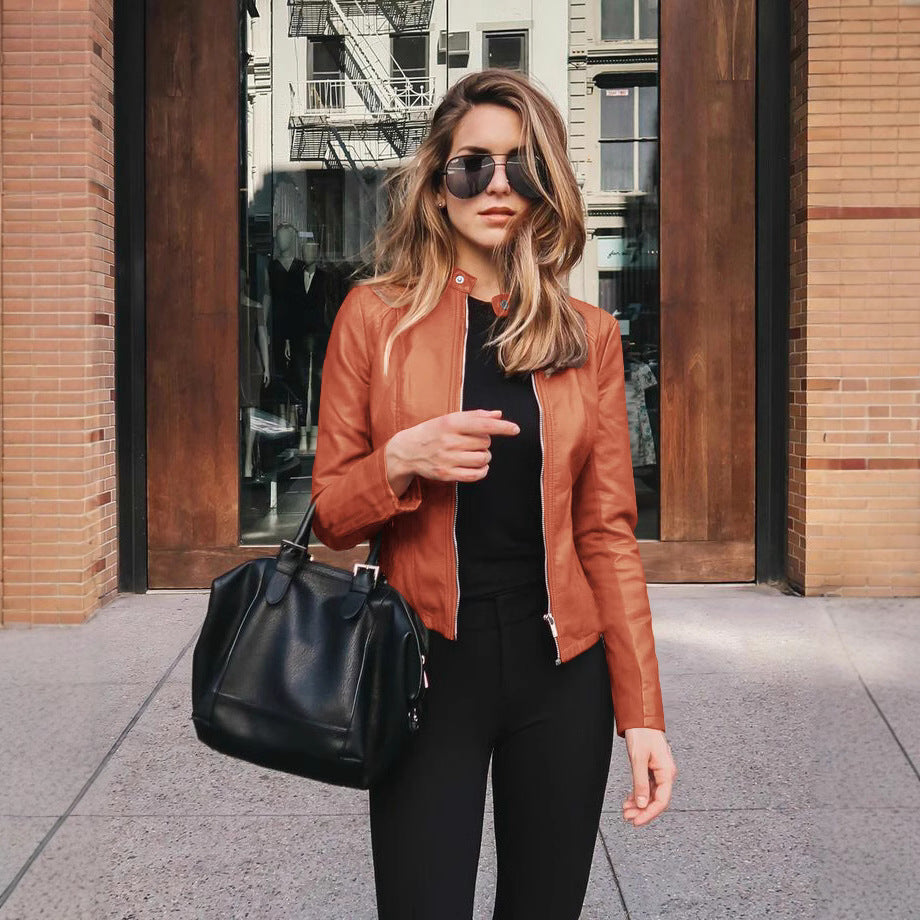 Ladies fitted faux leather biker jacket with stand-up collar and decorative seams Mune Fashion