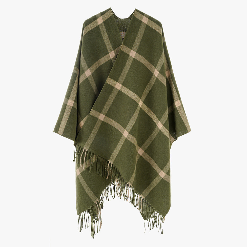 Women's large checkered wool look poncho in cape cut with loose drape and fringes.