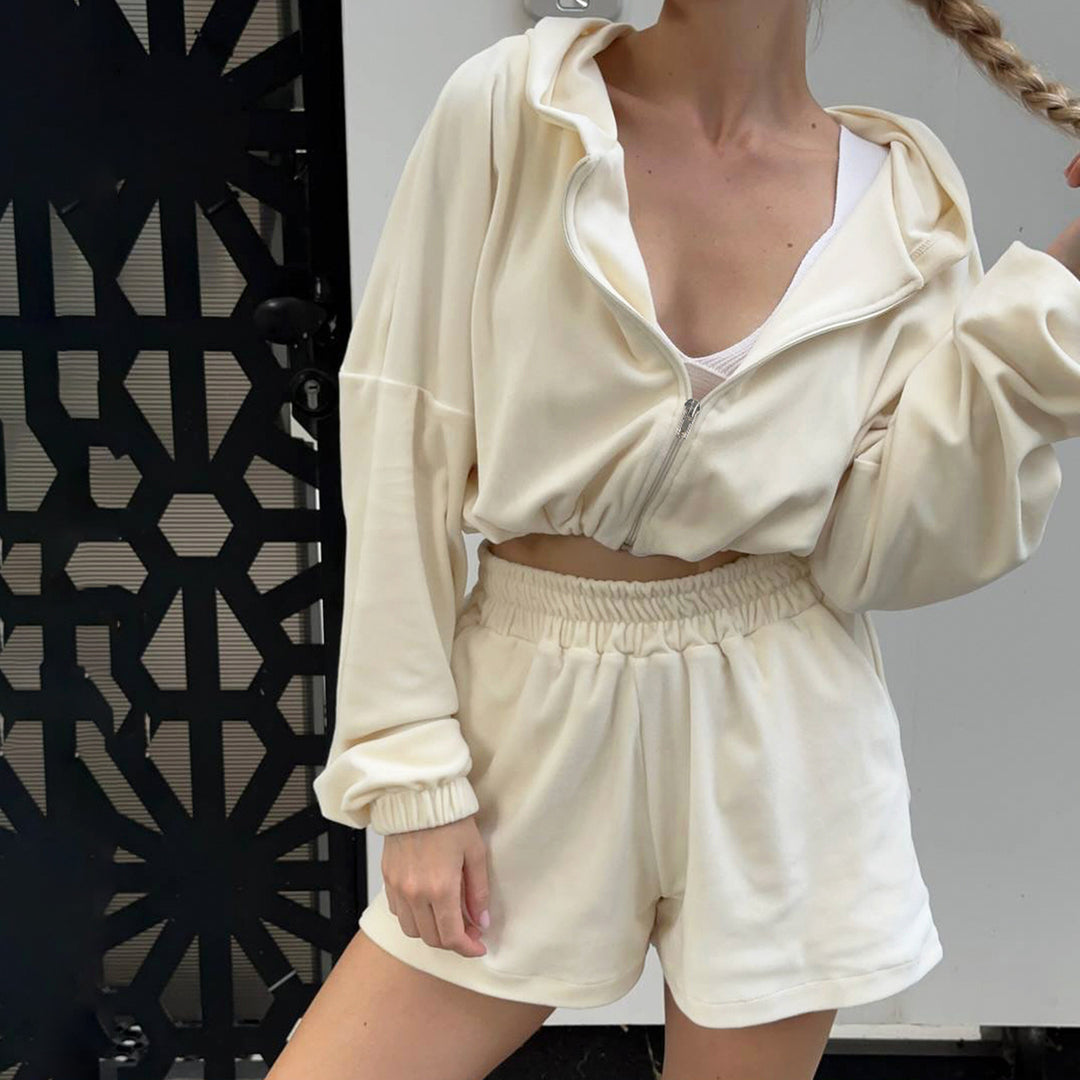 Women's cropped hoodie with drawstring at the waist, shiny satin look, front zipper and elastic cuffs Mune Fashion