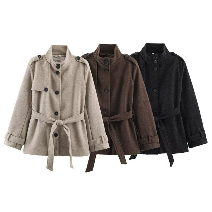 Women's short tailored coat jacket made of wool blend with standing collar, shoulder patches, and tie belt Mune Fashion
