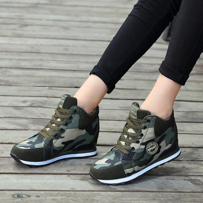 Women’s mid-high wedge running sneakers in a material mix with concealed inner wedge, padded ankle collar, and grippy tread sole Mune Fashion