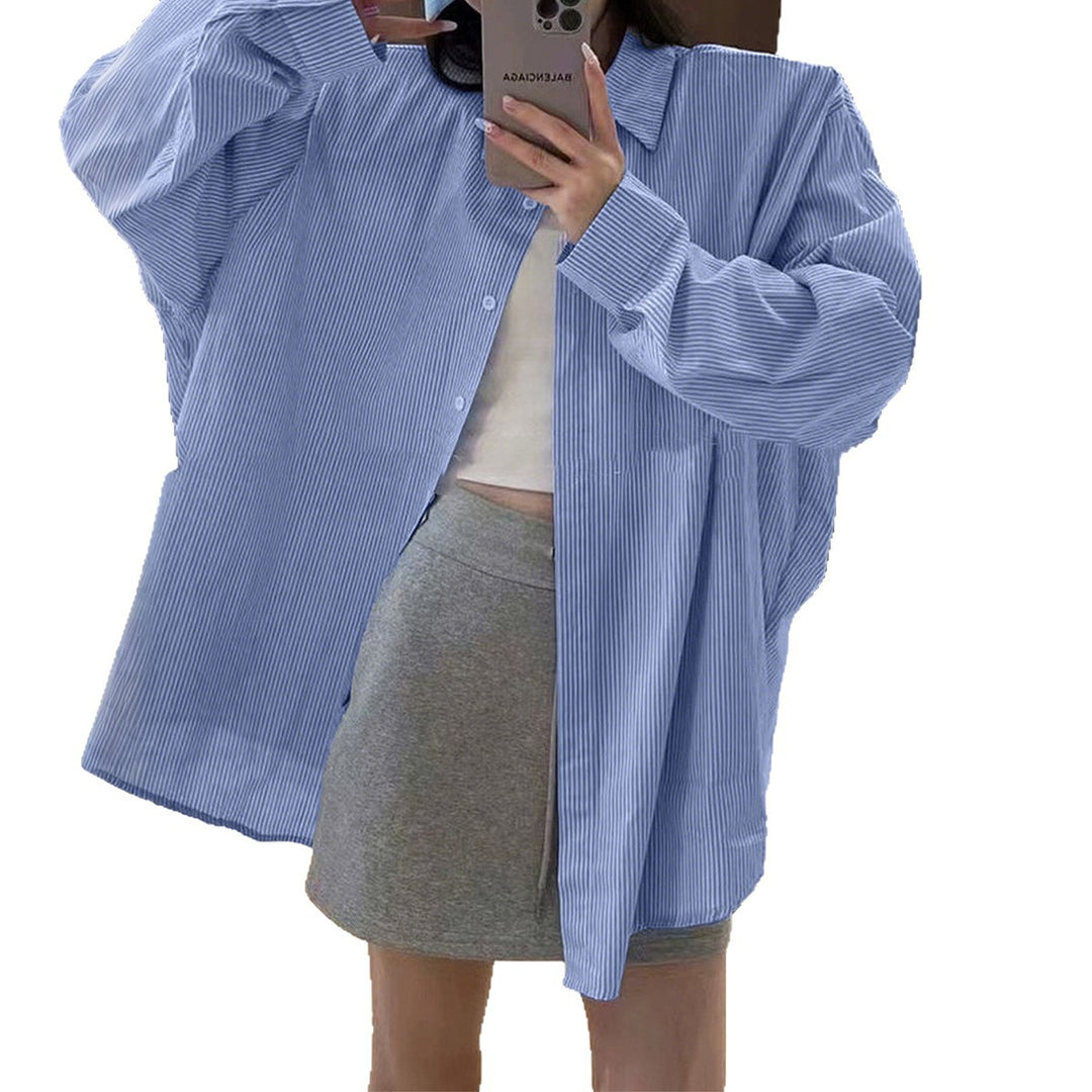 Women's oversized shirt with fine pinstripe structure, Kent collar, rounded hem, and buttoned cuffs Mune Fashion