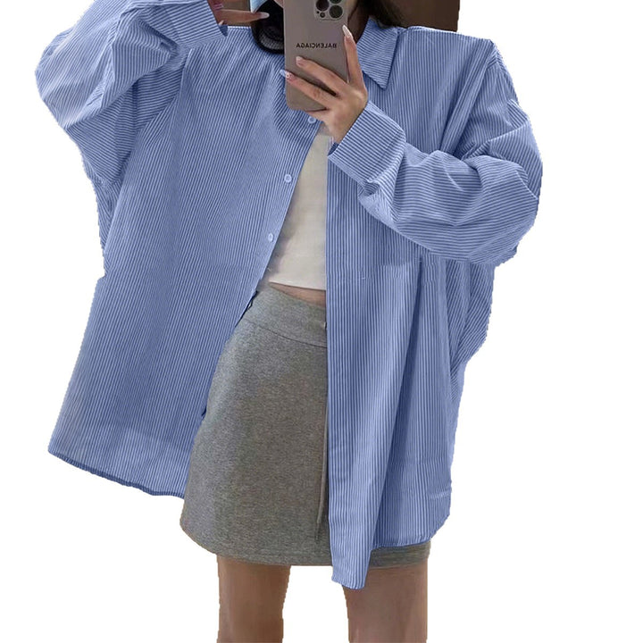 Women's oversized shirt with fine pinstripe structure, Kent collar, rounded hem, and buttoned cuffs Mune Fashion