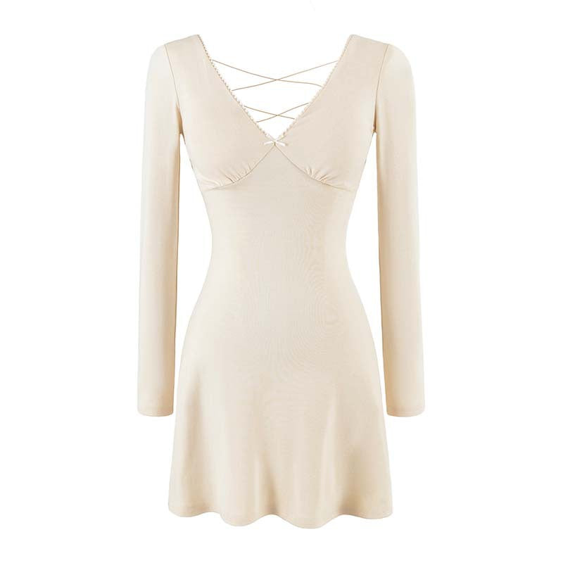 Ladies form-fitting mini dress with a deep V-neckline, gathered bust, and crossed back straps Mune Fashion