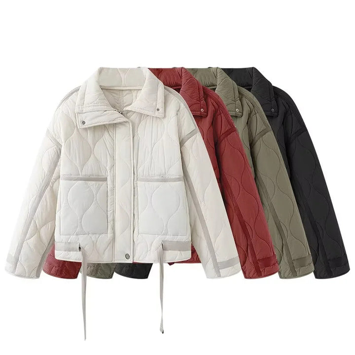 Women's quilted boxy transitional jacket with drawstring hem, stand-up collar, and patch pockets Mune Fashion