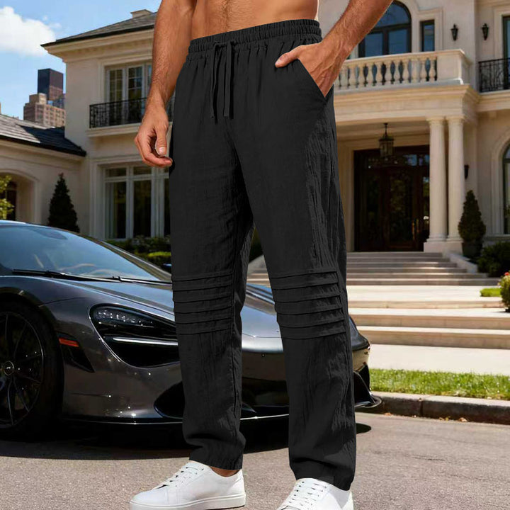 Men's relaxed linen jogging pants with elastic drawstring, pleated knee area, and side pockets Mune Fashion