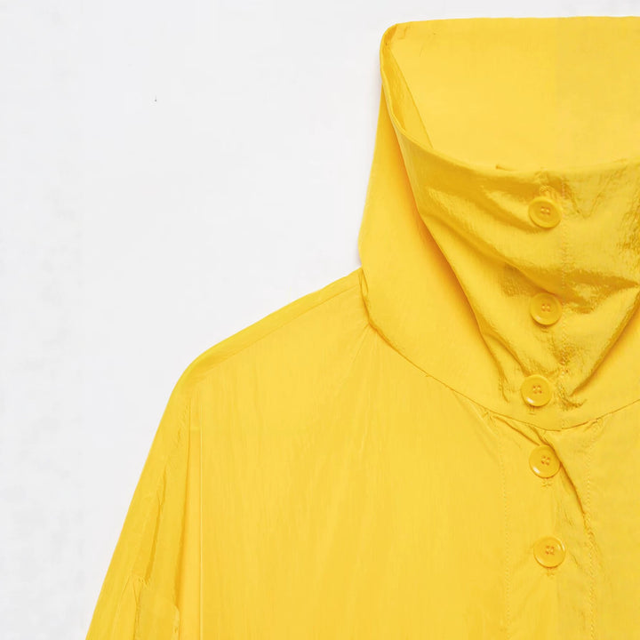 Women's lightweight cropped windbreaker with high stand-up collar and drawstring.