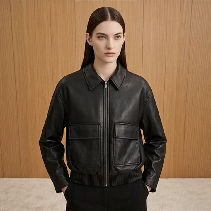 Women's short jacket made of faux leather in bomber style with ribbed hem and patch pockets Mune Fashion