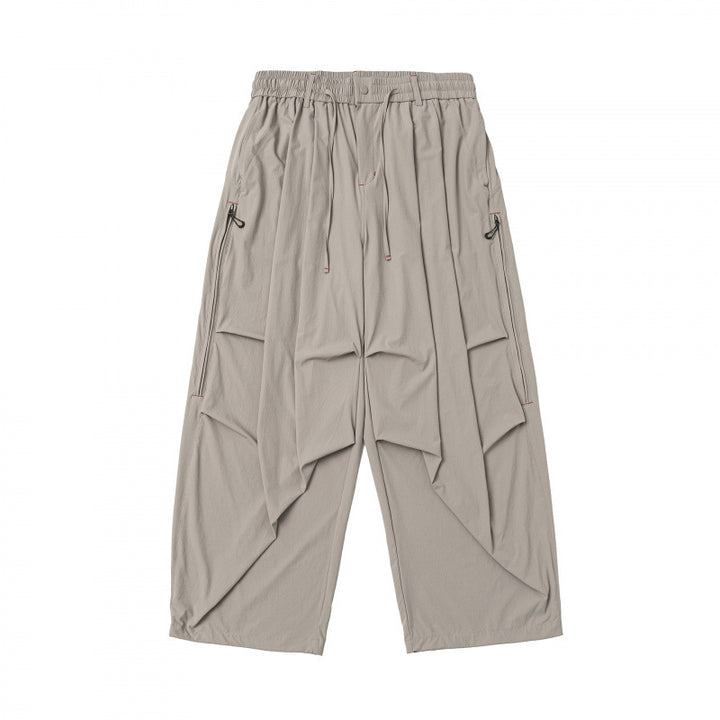 Unisex Loose-fitting technical cargo pants with elastic waistband, drawstring, and zip pockets Mune Fashion
