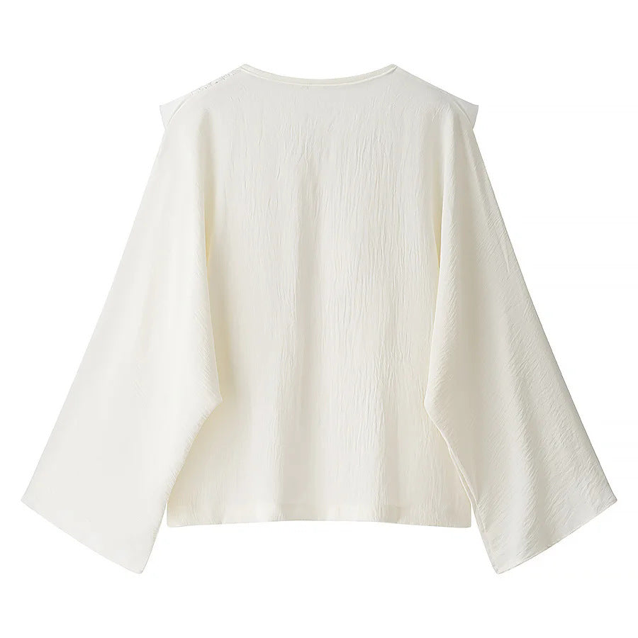 Women's embroidered ruffle blouse with pleated front, ribbon tie, and wide bell sleeves Mune Fashion
