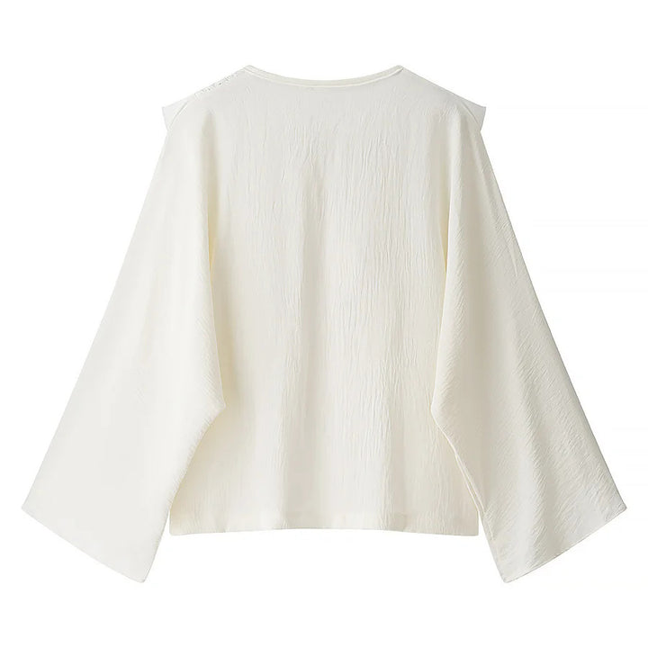 Women's embroidered ruffle blouse with pleated front, ribbon tie, and wide bell sleeves Mune Fashion