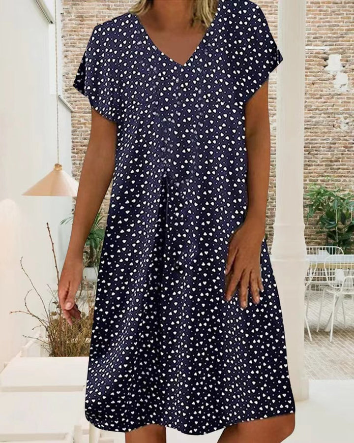 Ladies nan locker falling V-neck short dress with A-line cut, cap sleeves and all-over heart print Mune Fashion